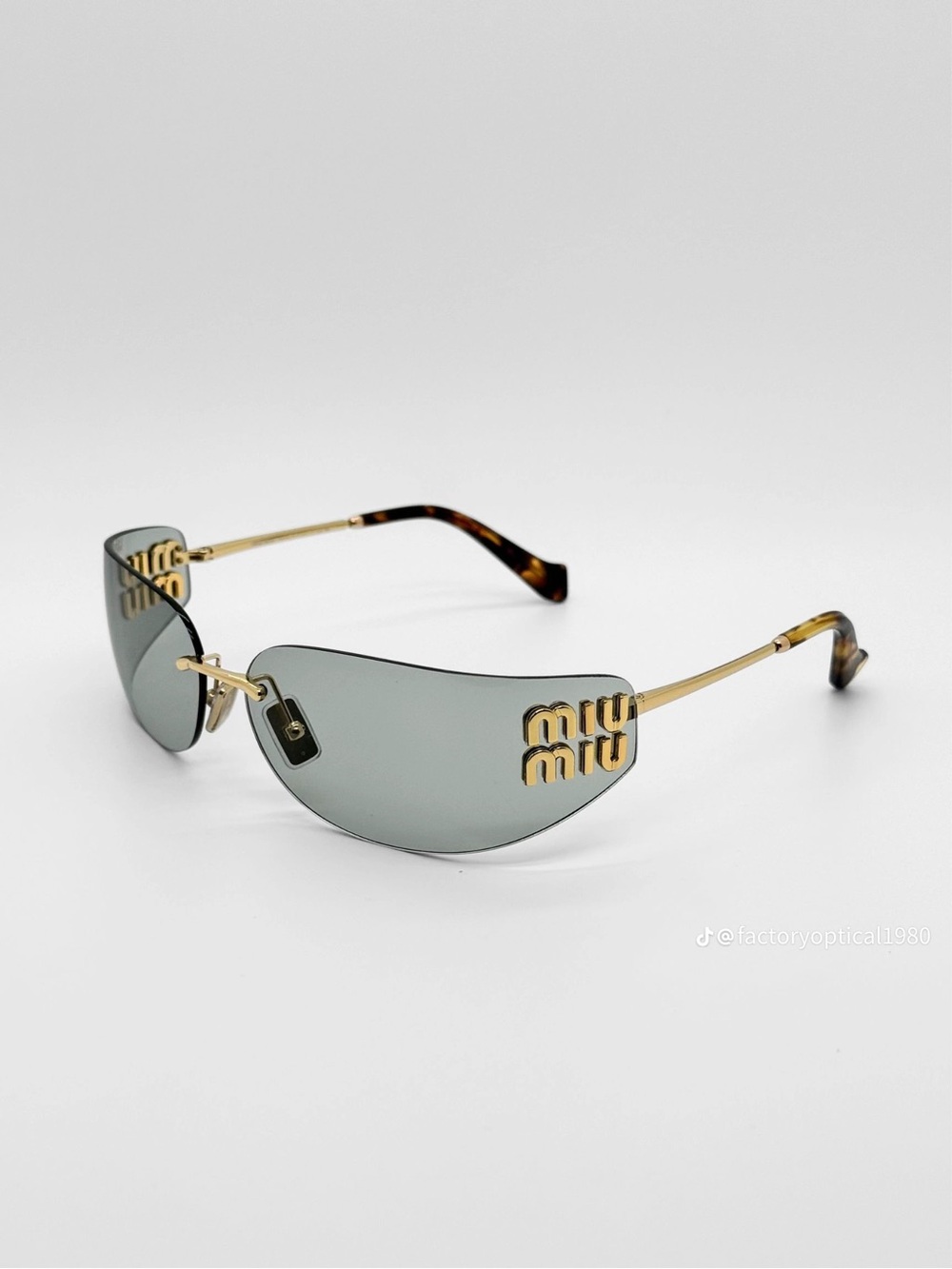 Miu Miu Gold-Tone Rimless Sunglasses with Gray Lenses